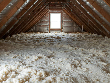 Insulation being blown into attic.