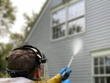 by Michigan Exterior Pros, power washing a house.