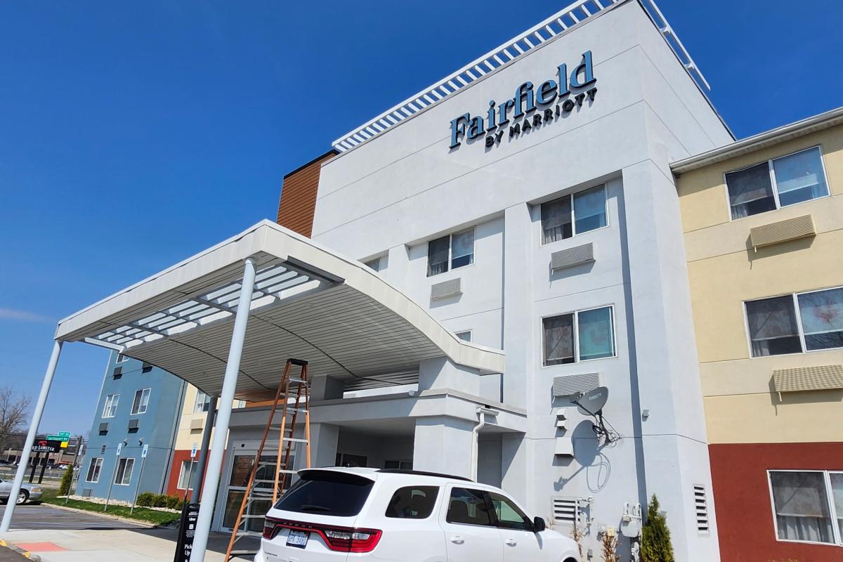 Fresh siding and heavy-duty seamless gutters on a Michigan business