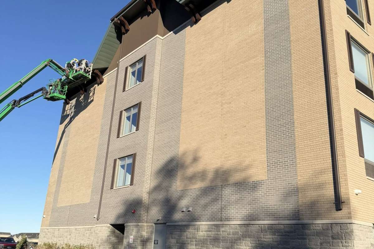 Seamless gutters instealled on commercial building by Michigan Exterior Pros.