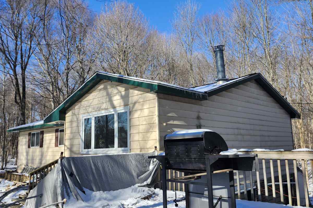 Green fascia installed on residential home by Michigan Exterior Pros.
