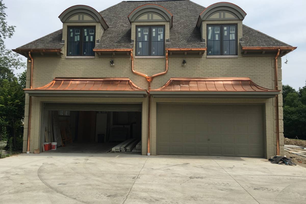 Residential copper gutters installed by Michigan Exterior Pros.