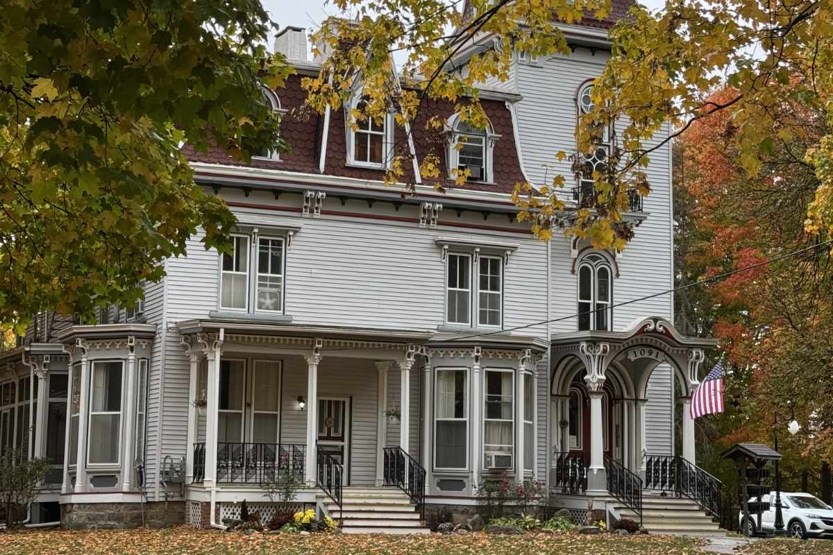A beautifully painted front door providing a pop of exterior color