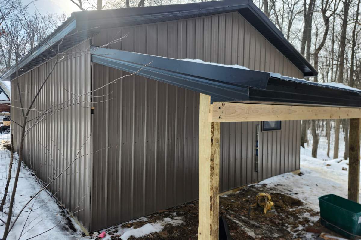 Custom brown colored pole barn built by Michigan Exterior Pros.