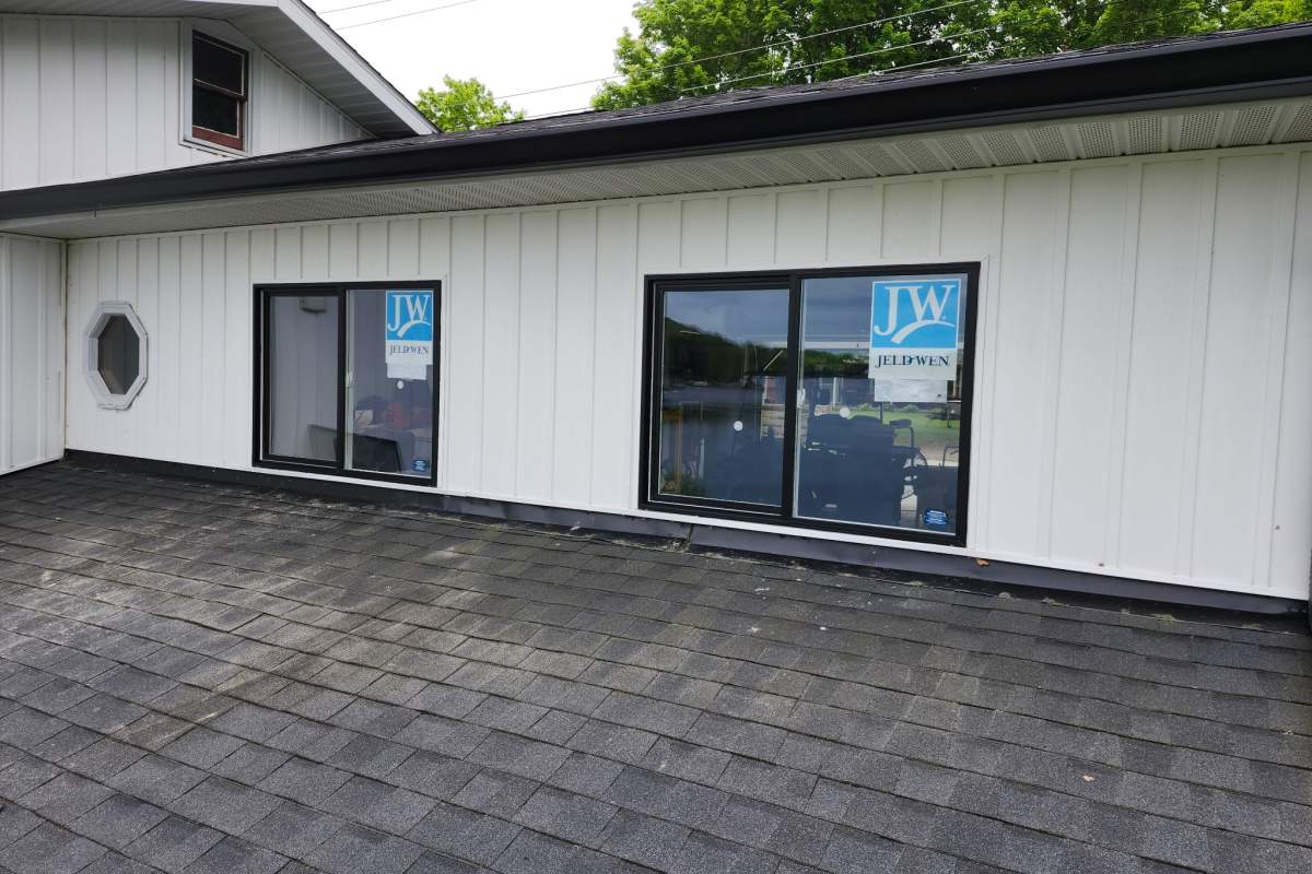 Black jeldwen sliding windows installed by Michigan Exterior Pros.