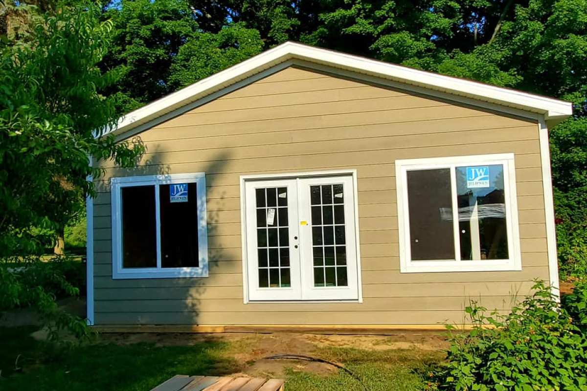 Windows and double entry doors installed by Michigan Exterior Pros.